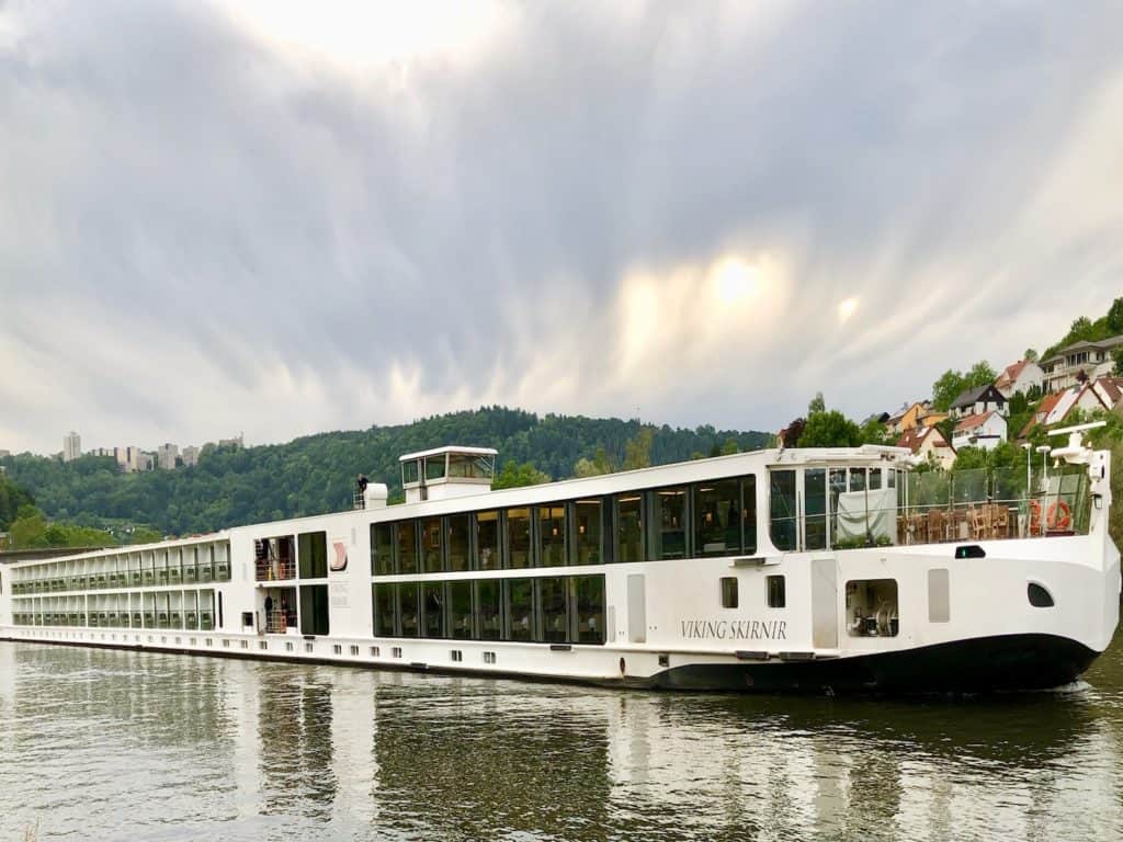 A Viking River Cruise ship is docked along a river in Europe.
