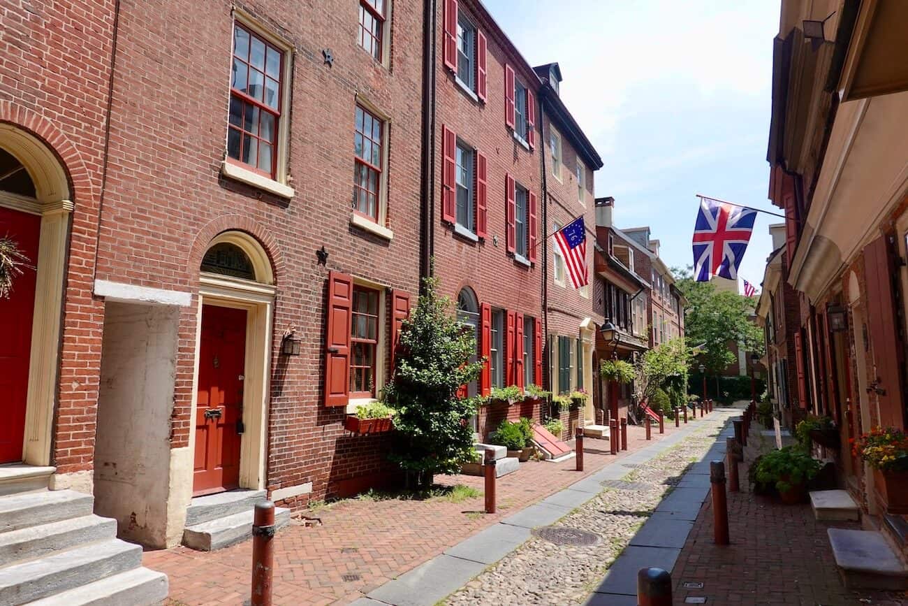 An American and British flag fly along Elfreth's Alley in Philadelphia.