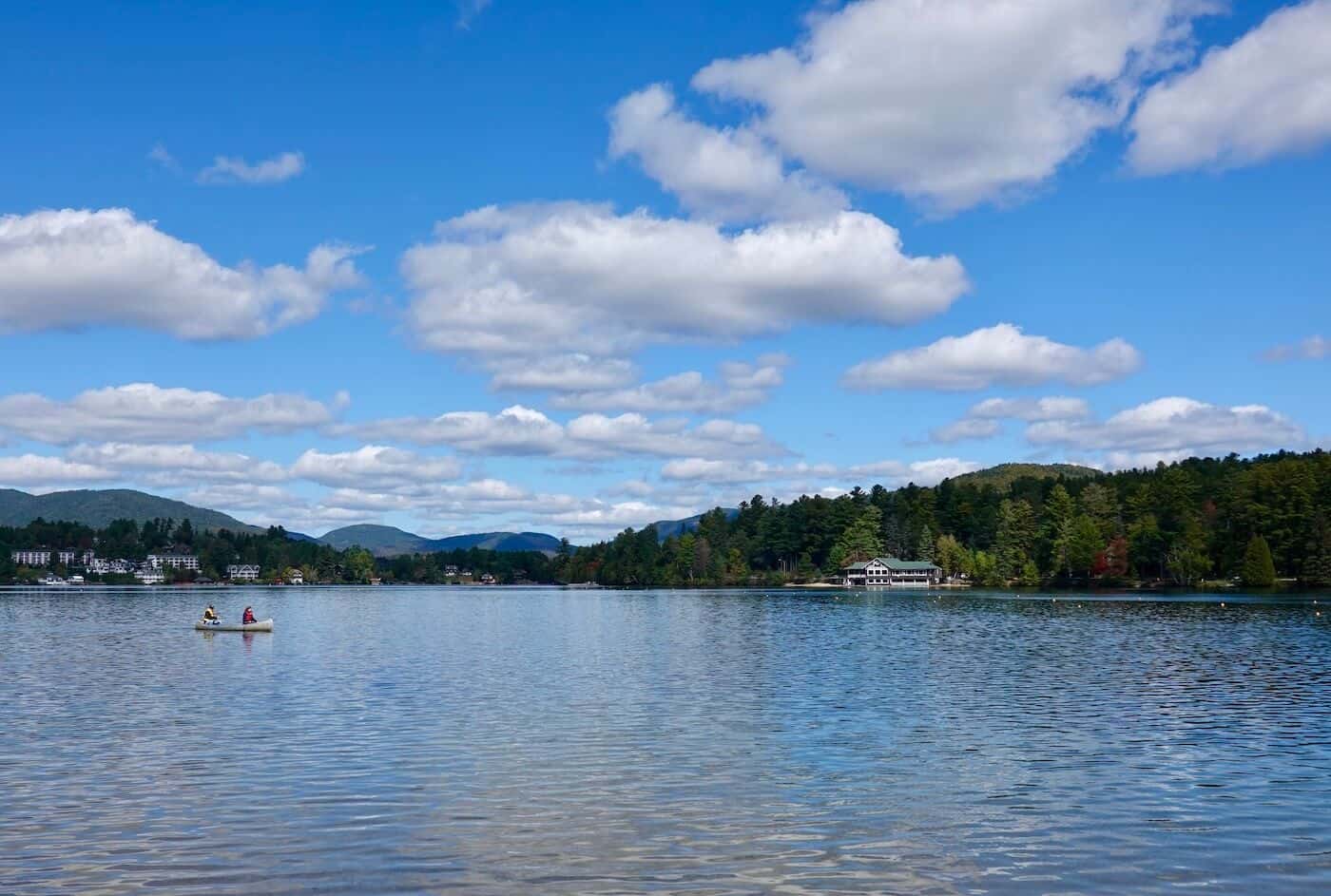 A picture of people kayaking on Mirror Lake in Lake Placid.