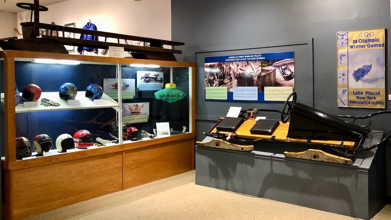 A display of Olympic bobsleds, helmets and gear in the Winter Olympic museum in Lake Placid.