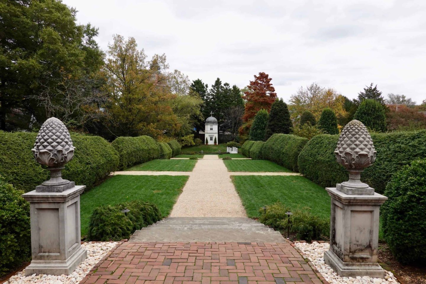 A path in the William Paca House garden beckons visitors to the spring house in the distance.
