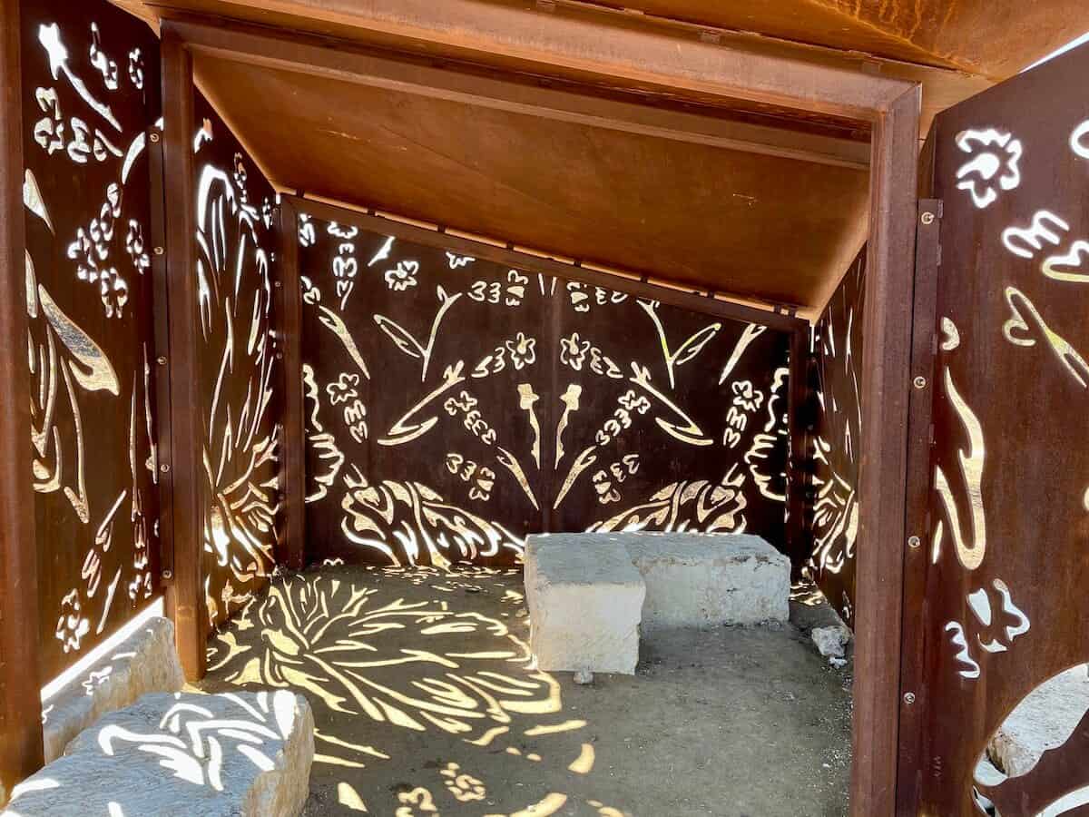 A wildlife blind at Hardberger Park has decorative cutouts on its metal walls.
