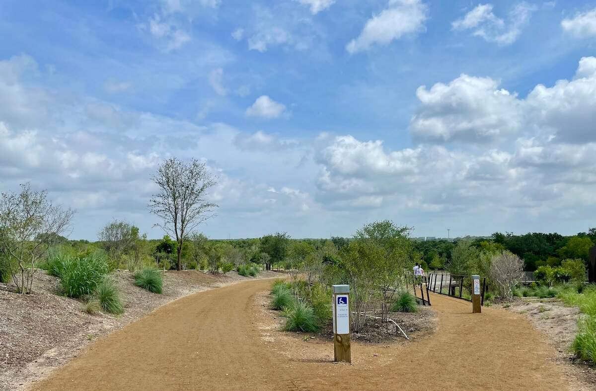 A dirt trail splits into two sections in Hardberger Park.