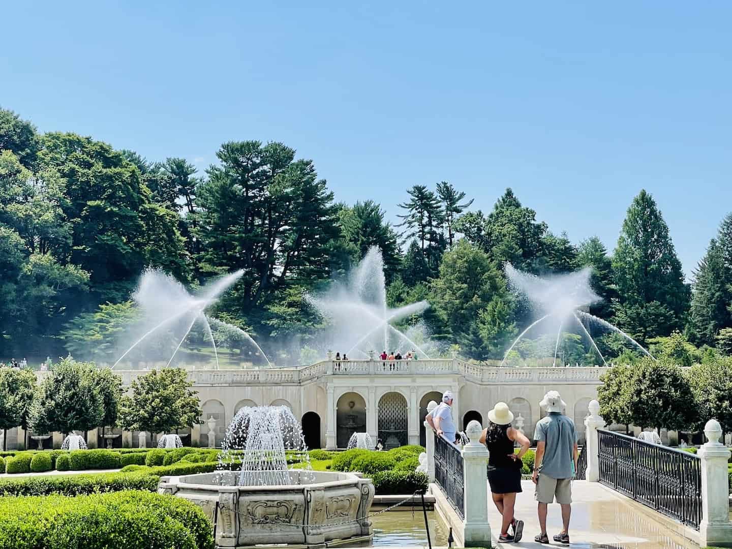 Spectators watch a display of water fountains at Longwood Gardens, PA.