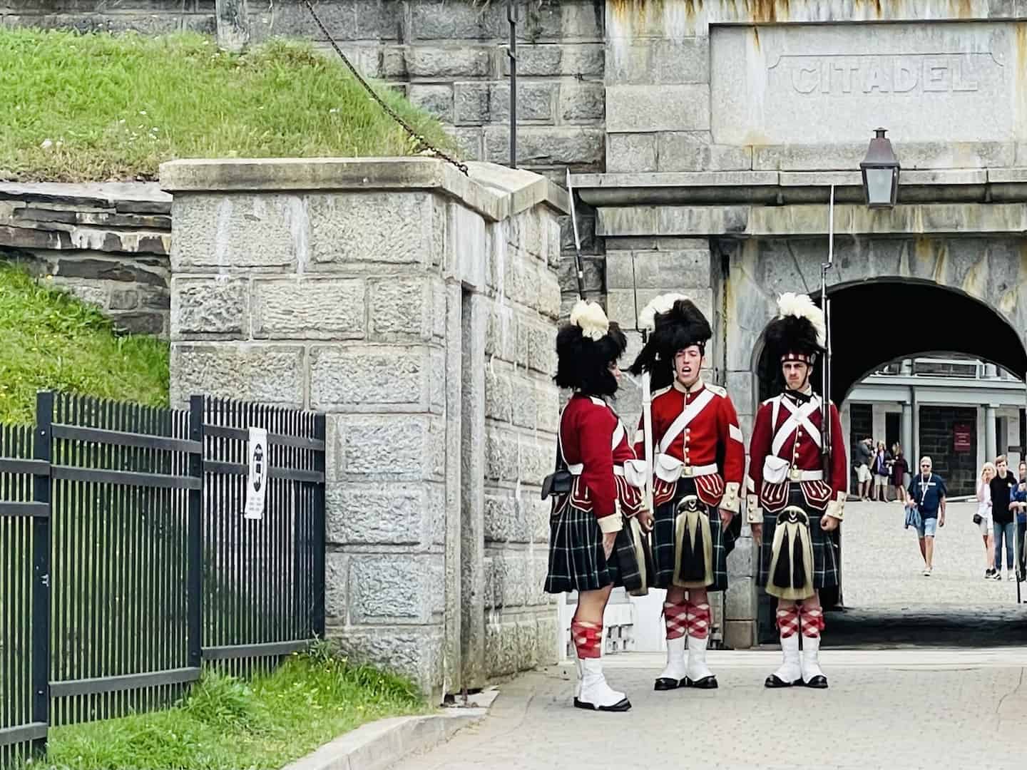 Three soldiers participate in the changing of the guard at the Halifax Citadel.