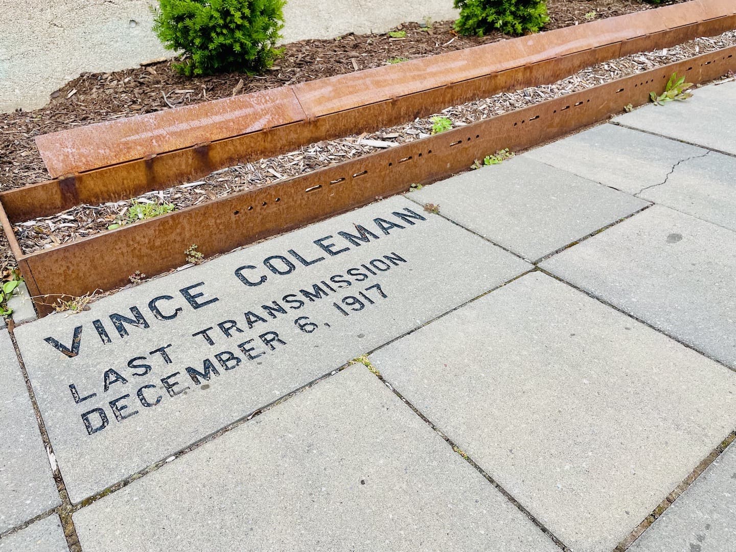 A stone engraved with a name of a telegraph operator and his Morse Code message are at a memorial to the Halifax Explosion.