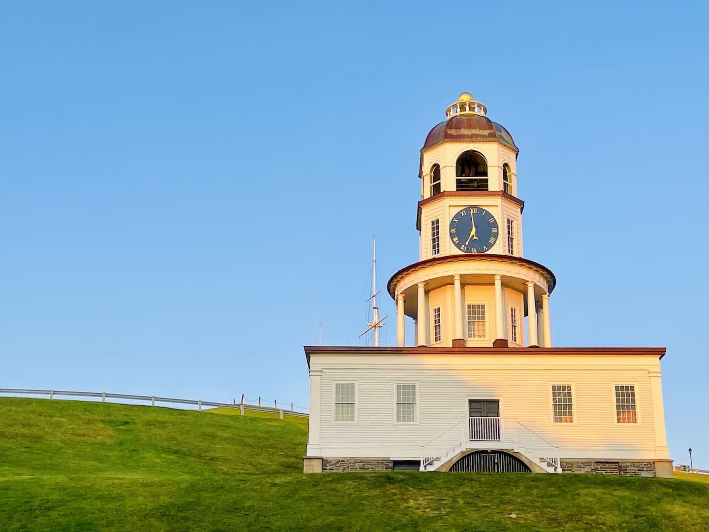 A large clock with a cupola sits on a building near the Halifax Citadel.