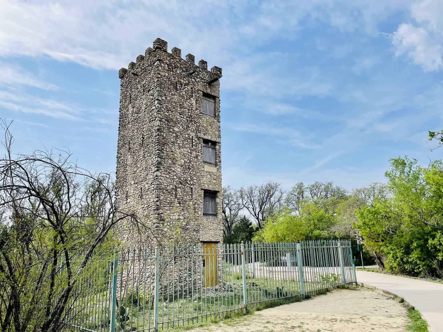 A four-story stone tower sits on a hilltop at Comanche Lookout Park in San Antonio. Texas.