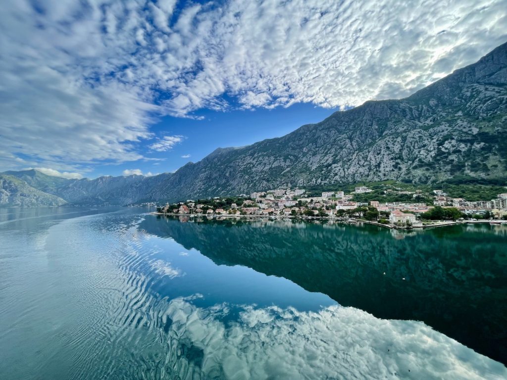 Clouds and mountains stand tall over the ancient town of Kotor, Montenegro