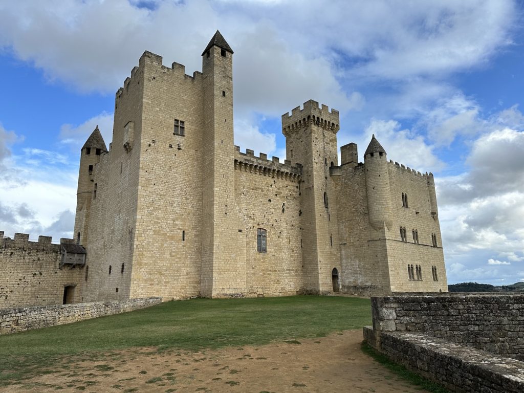 The imposing stone Chateau de Beynac features turrets and watchtowers in southwest France.